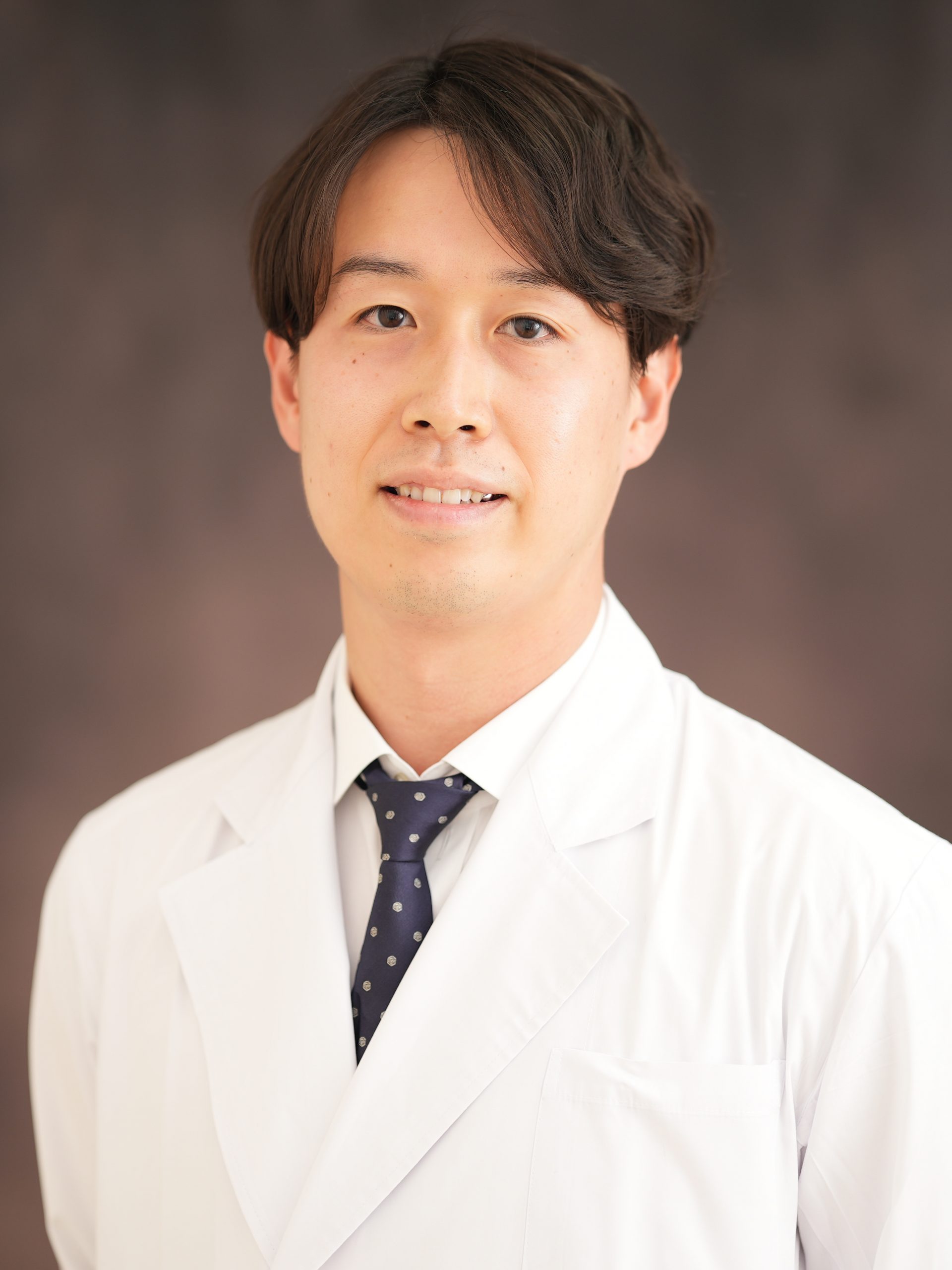 首藤 孝治